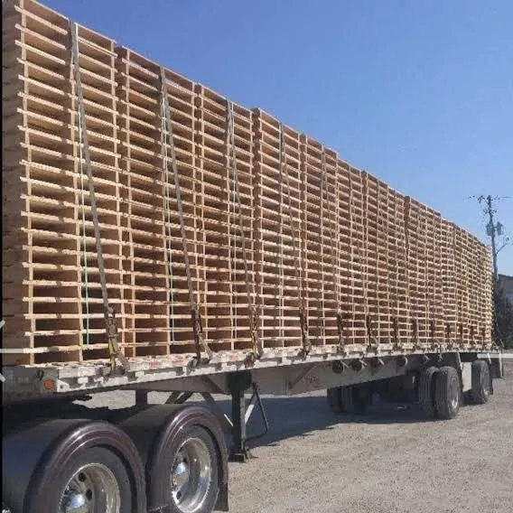 Chain-strapped flatbed in freight corridor
