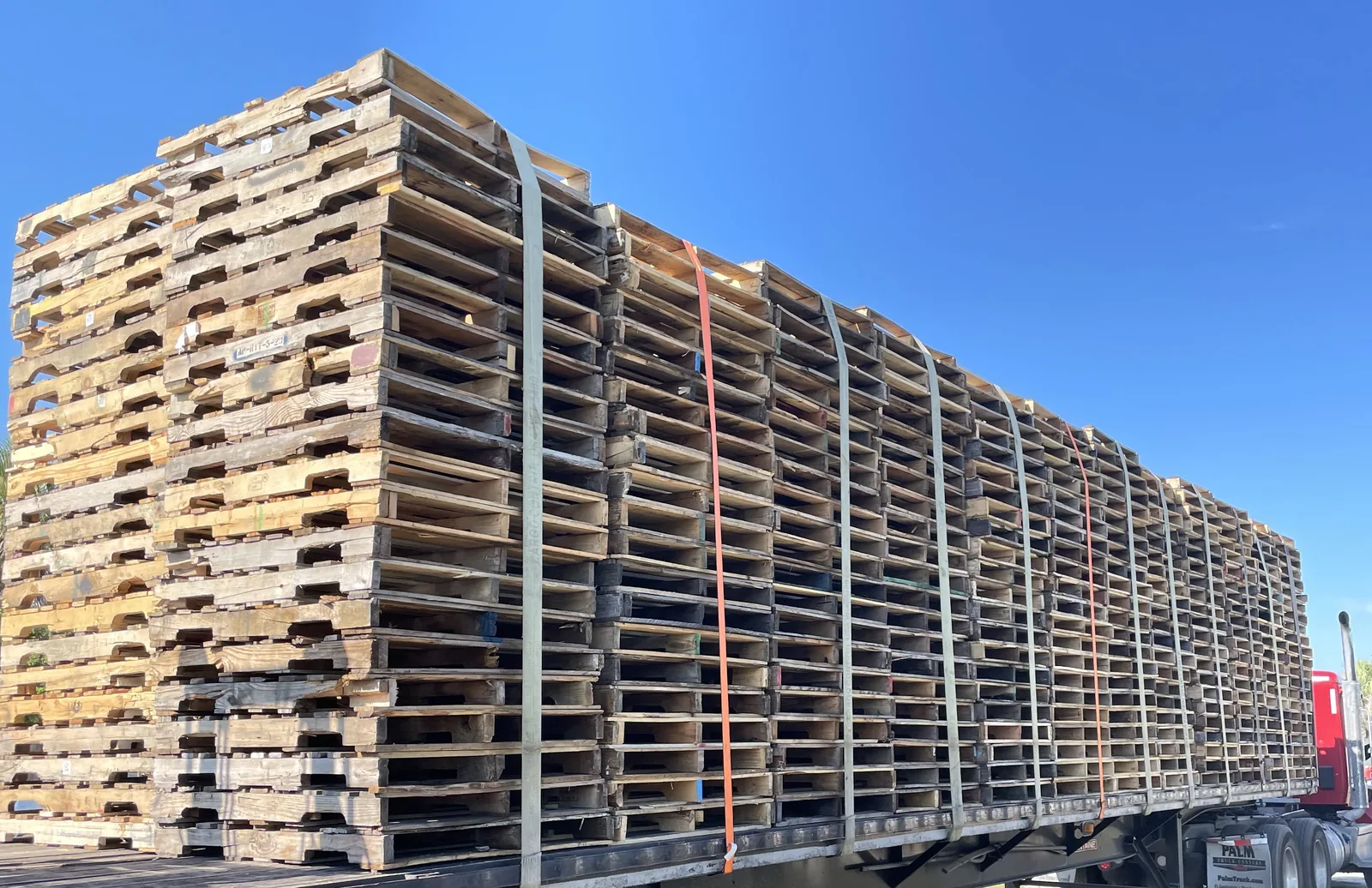 Flatbed truck with full pallet load on national route