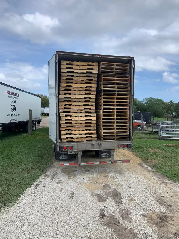 Industrial flatbed truck delivering pallet load