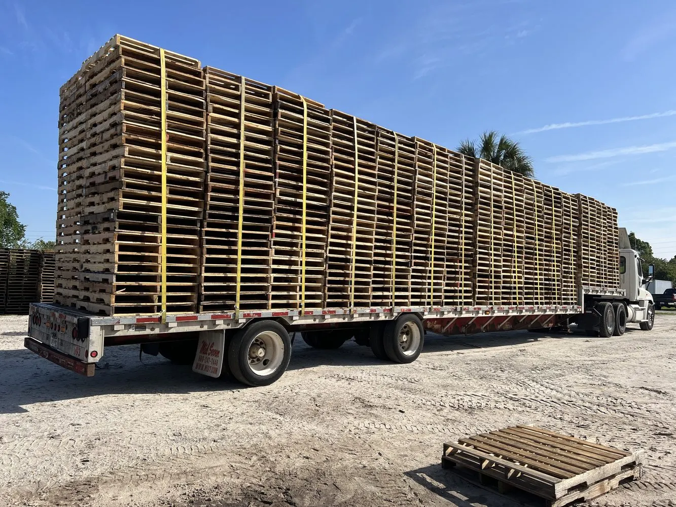 Green Mack truck part of national pallet fleet