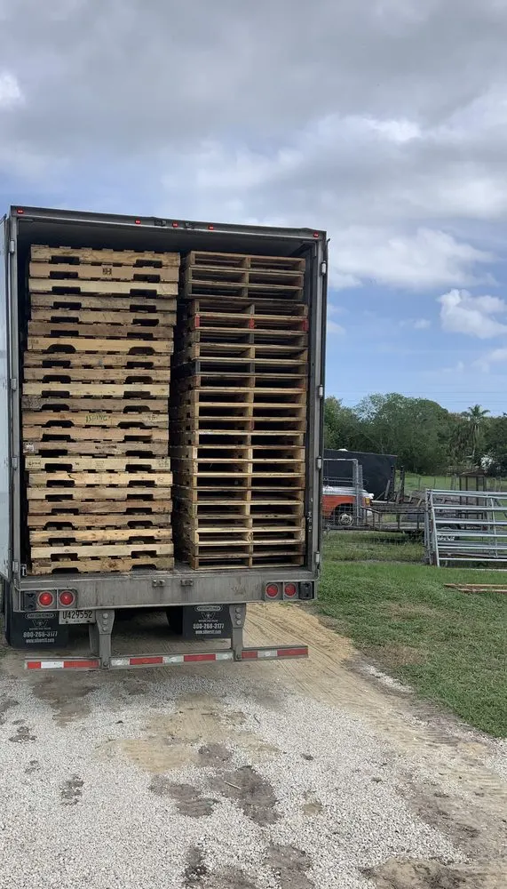 Industrial box truck loaded with wood pallets for B2B distribution