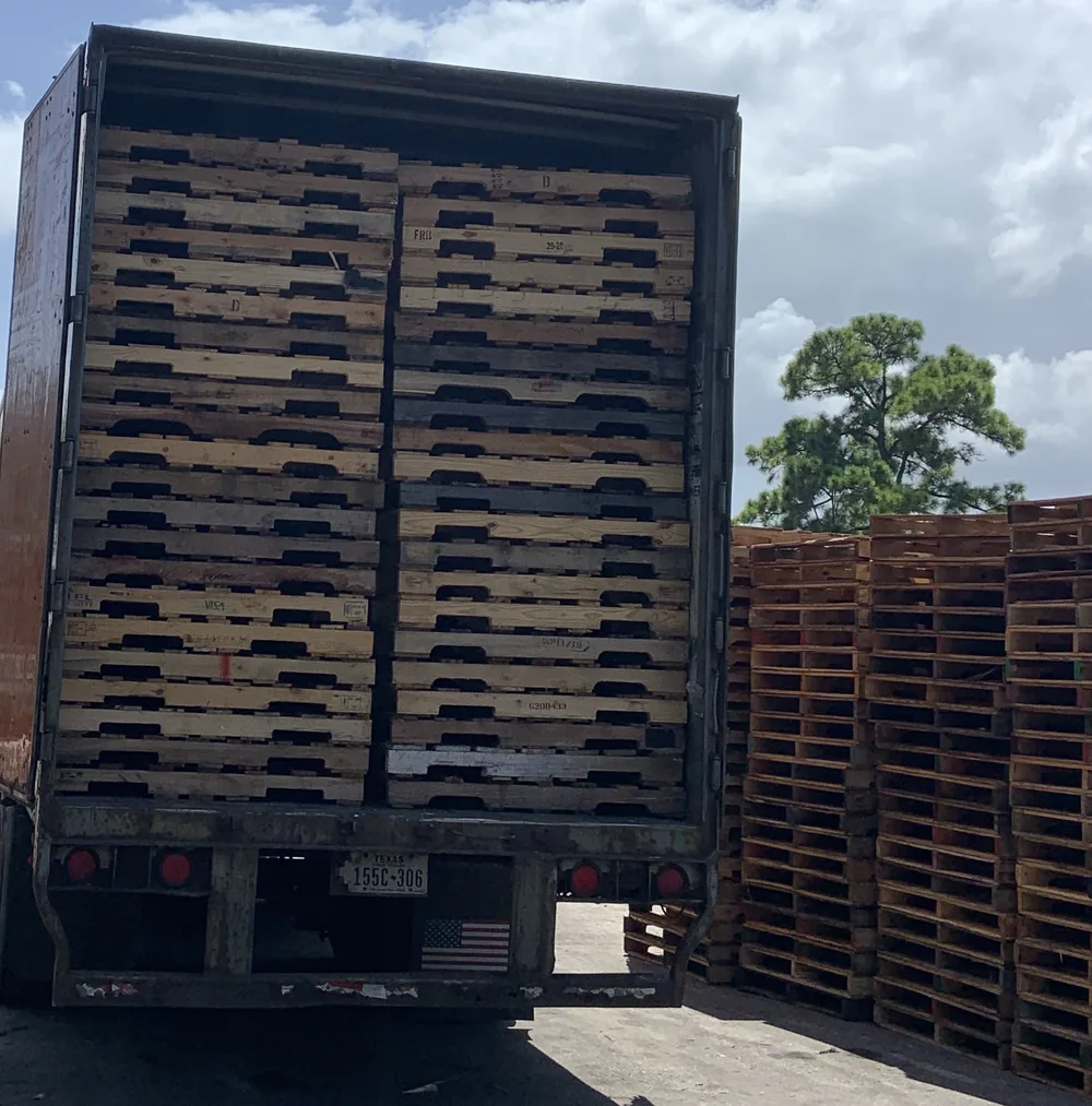 Pallet delivery truck and dry van at supply yard
